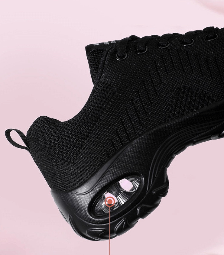 Close-up of stylish breathable flexible women's sneaker with cushioned EVA sole and non-slip grip on pink background.